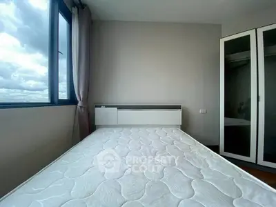 Modern minimalist bedroom with large window and wardrobe