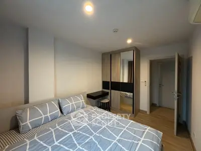 Modern bedroom with stylish decor and ample storage space