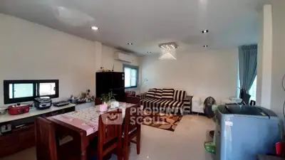 Spacious living room with modern decor and ample natural light