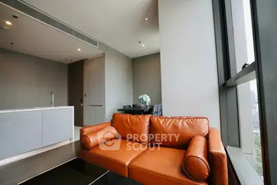 Modern living room with sleek design and leather sofa in high-rise apartment