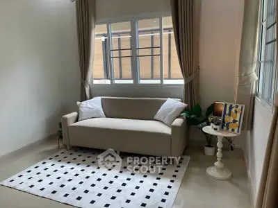 Cozy living room with modern sofa and stylish decor, perfect for relaxation.