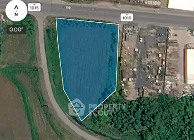 Prime real estate land plot with strategic road access and development potential.