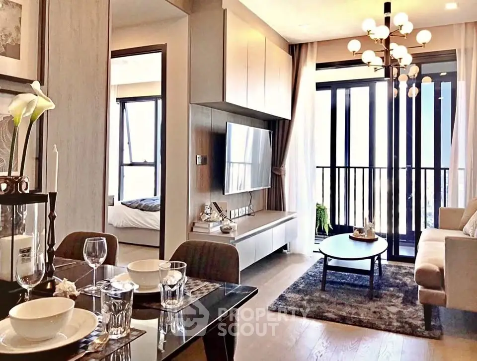 Modern living room with elegant decor and large windows offering natural light and a cozy atmosphere.