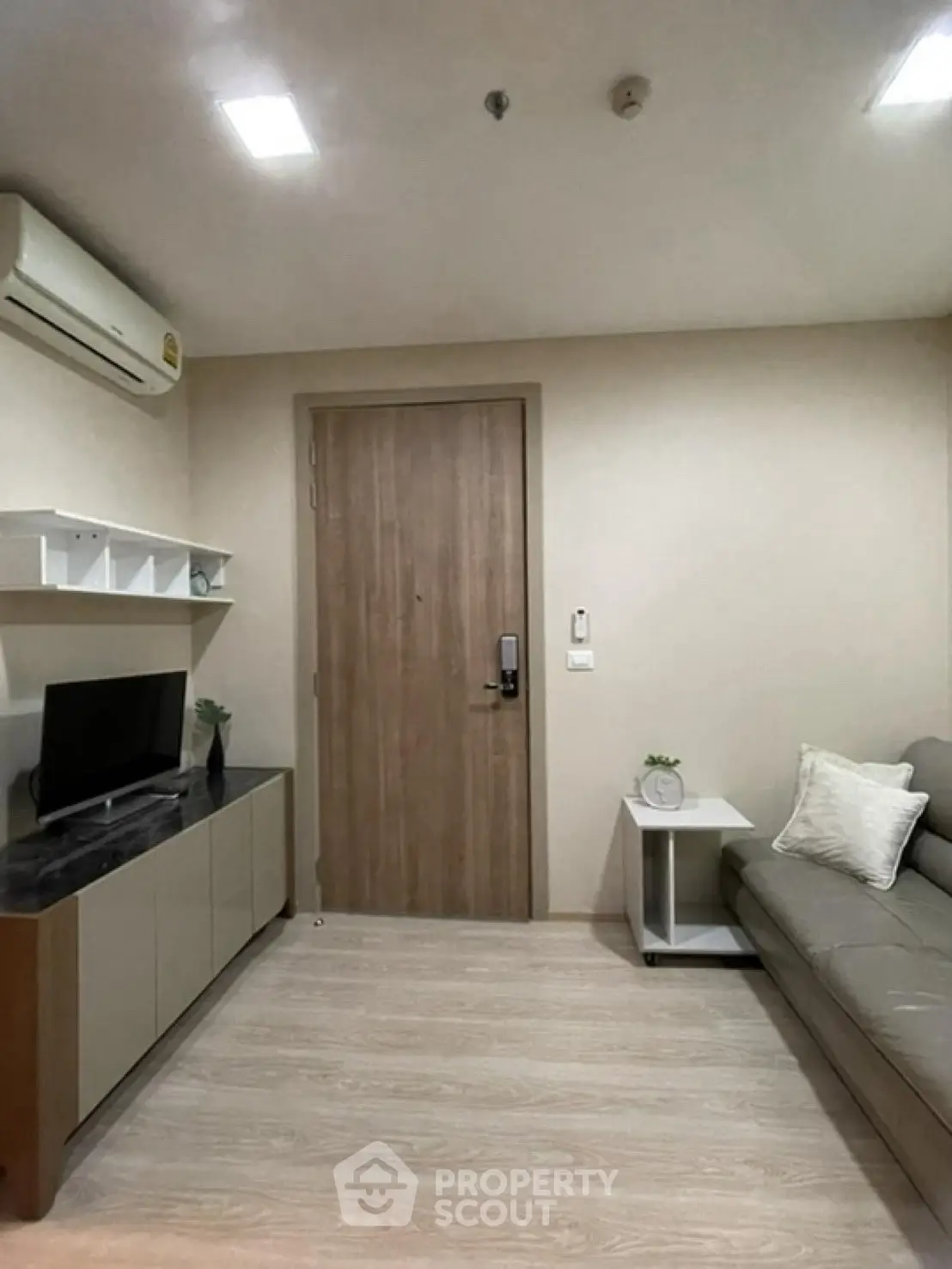 Modern living room with sleek furniture and neutral tones