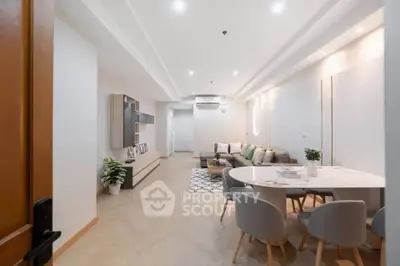 Spacious modern living room with stylish decor and open dining area