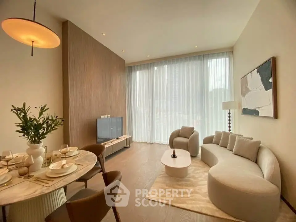 Modern living room with elegant decor and large windows in a luxury apartment.