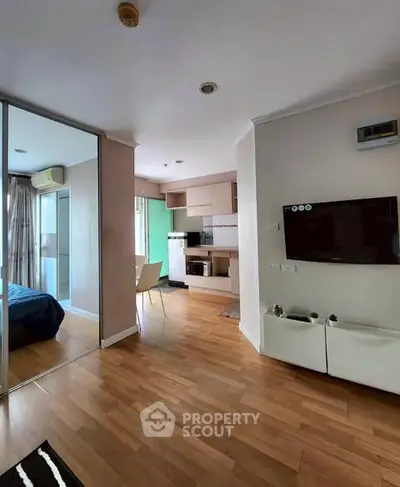 Modern apartment interior with open kitchen and cozy living area