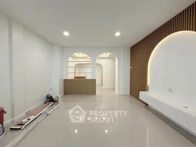 Modern minimalist living room with sleek design and elegant lighting