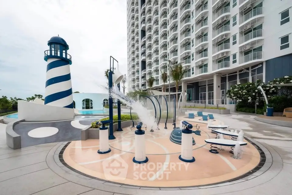 Luxurious beachfront condominium with unique lighthouse feature and modern outdoor amenities.