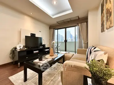 Spacious living room with modern decor and city view balcony in a high-rise apartment.