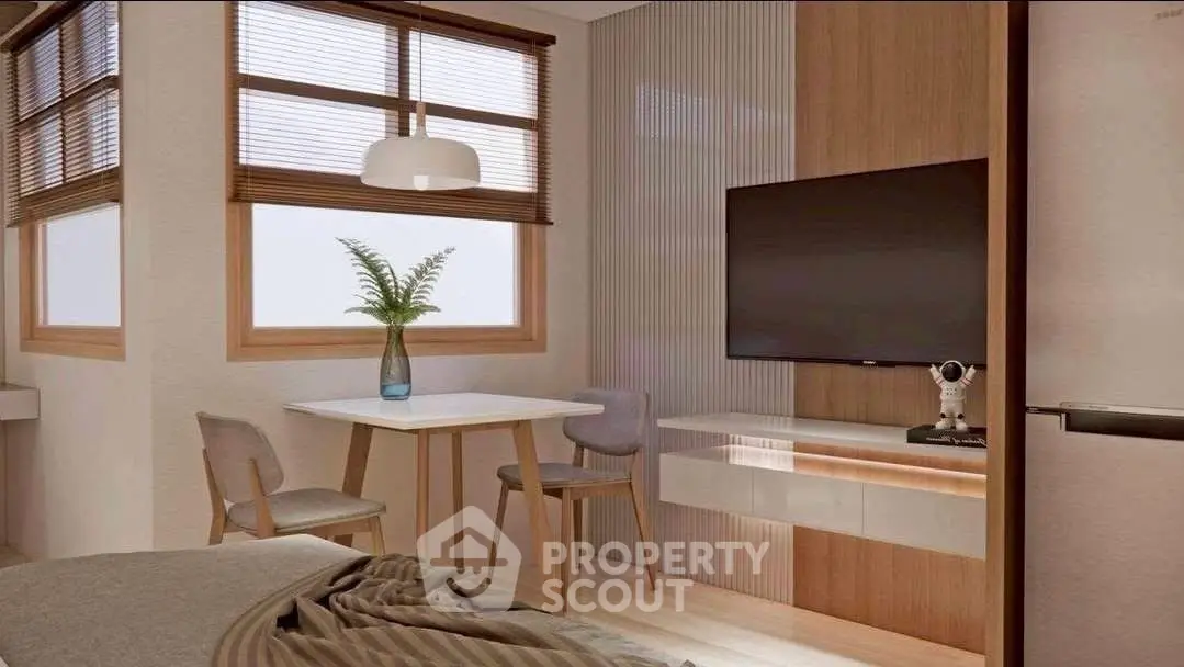 Modern living room with stylish decor, featuring a wall-mounted TV and cozy dining area.