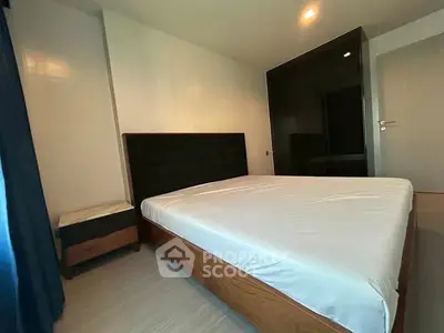 Spacious bedroom with modern design and large bed in a stylish apartment.