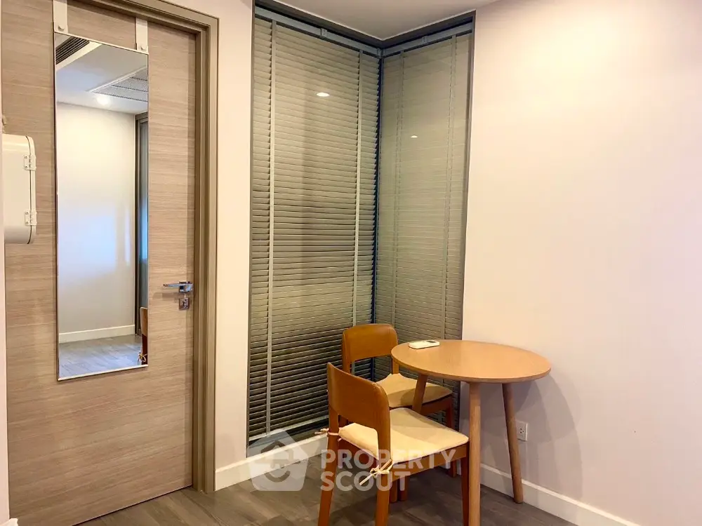 Cozy corner with round table and chairs in modern apartment interior