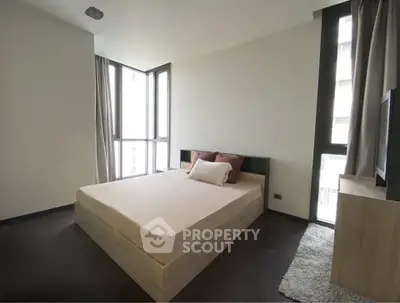 Modern bedroom with large windows and minimalist decor