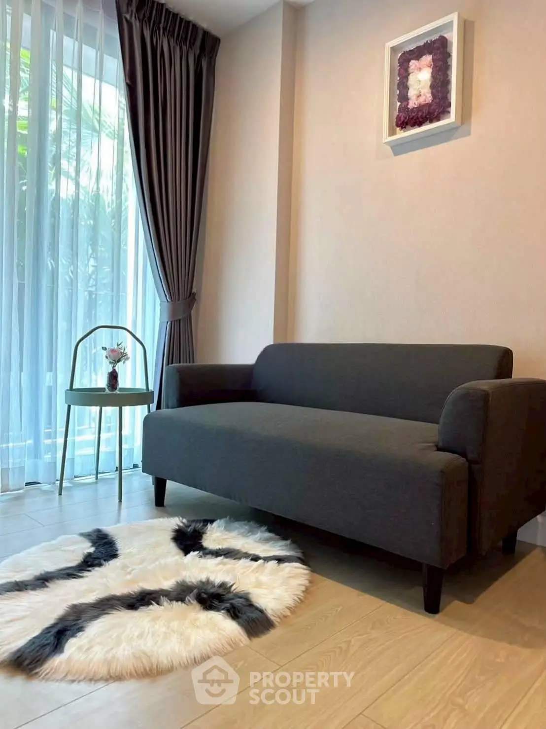 Cozy living room with modern sofa, stylish rug, and elegant decor
