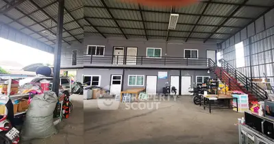 Spacious industrial-style warehouse with mezzanine and ample storage space.