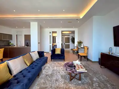Luxurious modern living room with plush seating and elegant decor in a high-end apartment.