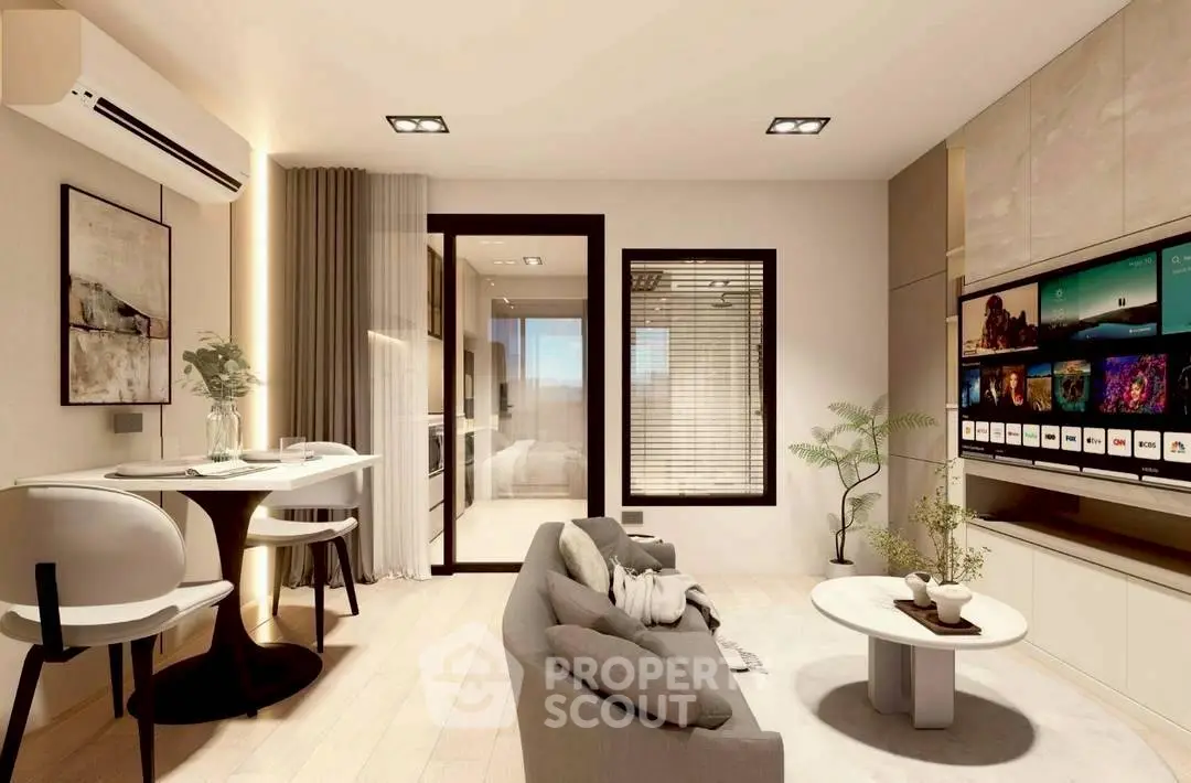 Modern living room with stylish decor and large TV, perfect for relaxation and entertainment.