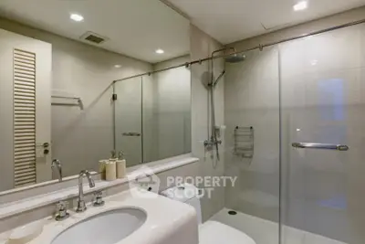 Modern bathroom with glass shower and sleek fixtures