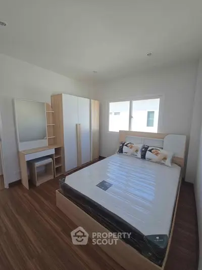 Modern bedroom with sleek furniture and natural light