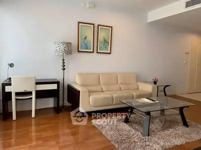 Spacious living room with modern furniture and elegant decor in a stylish apartment.