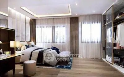 Luxurious modern bedroom with elegant decor and spacious walk-in closet.