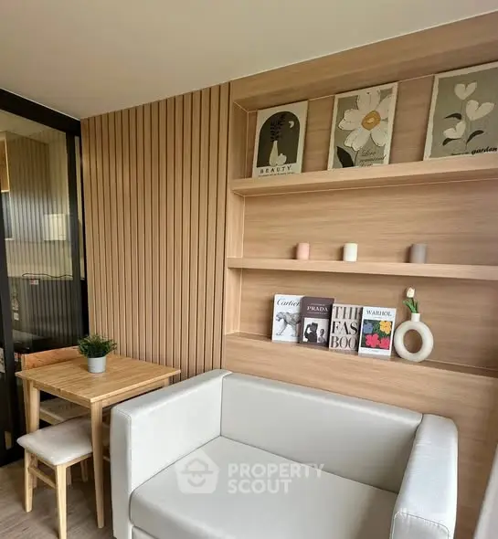 Modern living room with stylish decor and cozy seating area, perfect for relaxation and reading.