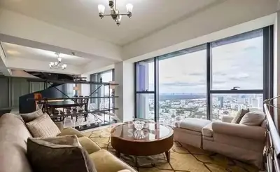 Luxurious living room with panoramic city view and elegant furnishings