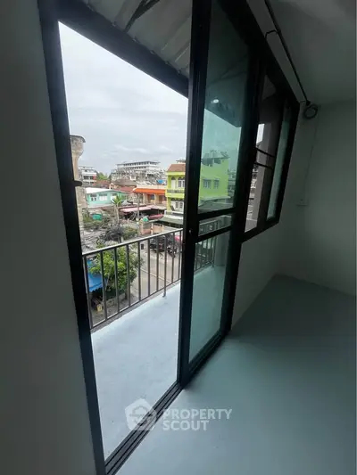 Charming balcony with urban view, perfect for city living enthusiasts.