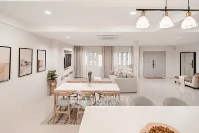 Spacious open-concept living and dining area with modern decor and ample natural light.