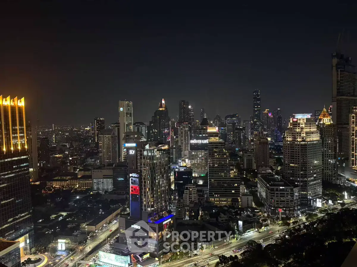 Stunning nighttime cityscape view showcasing vibrant urban skyline and illuminated skyscrapers.