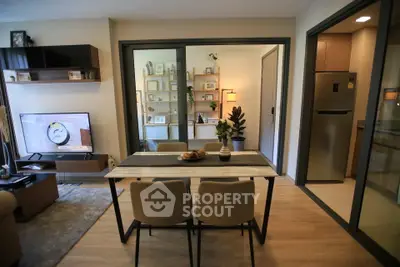 Modern living room with open kitchen and stylish decor