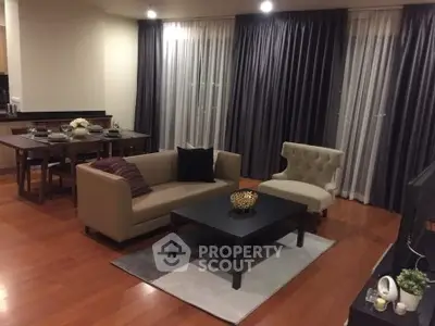 Spacious modern living room with elegant furniture and dining area, perfect for entertaining.