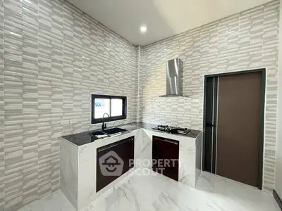 Modern kitchen with sleek design and gas stove in stylish home