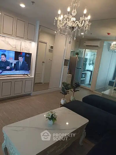Luxurious living room with elegant chandelier and modern decor