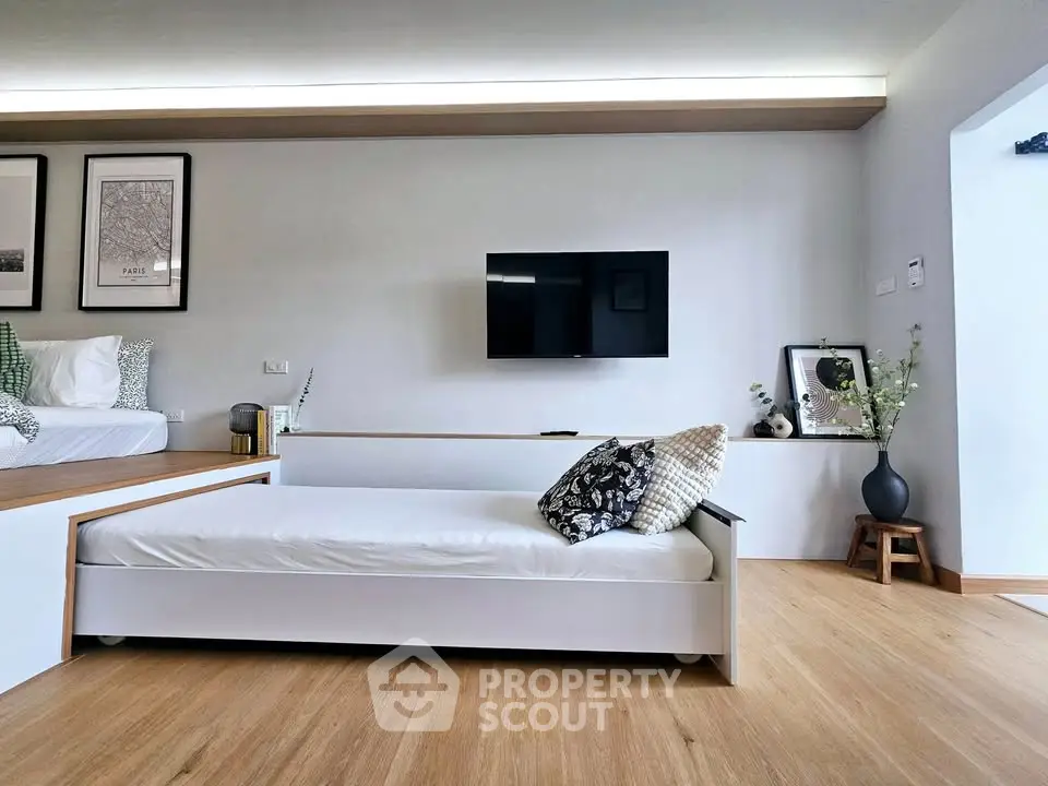 Modern living room with sleek design and cozy daybed