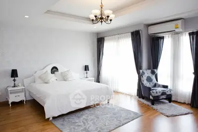 Elegant bedroom with stylish decor and natural light
