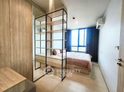 Modern bedroom with large window and stylish shelving unit