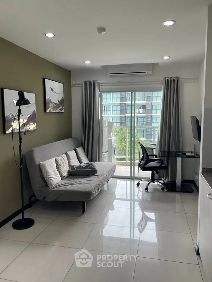Modern living room with large window and stylish decor in urban apartment