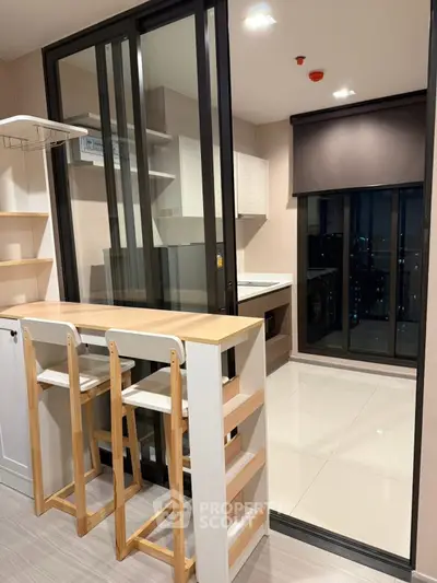 Modern kitchen with sleek design and breakfast bar in high-rise apartment