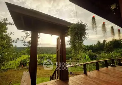 Charming wooden deck with lush green views and hanging plants, perfect for serene outdoor living.
