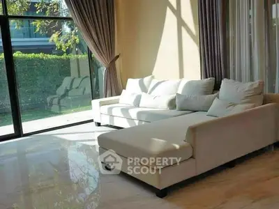 Luxurious living room with elegant sofa and large window view