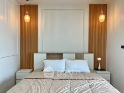 Modern bedroom with stylish lighting and cozy bedding