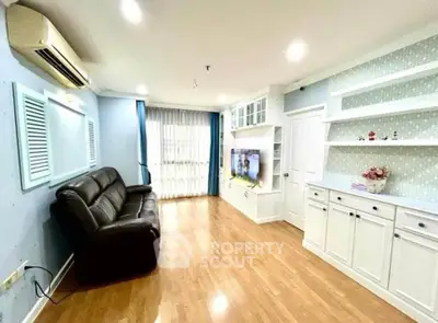 Spacious living room with modern decor and ample natural light