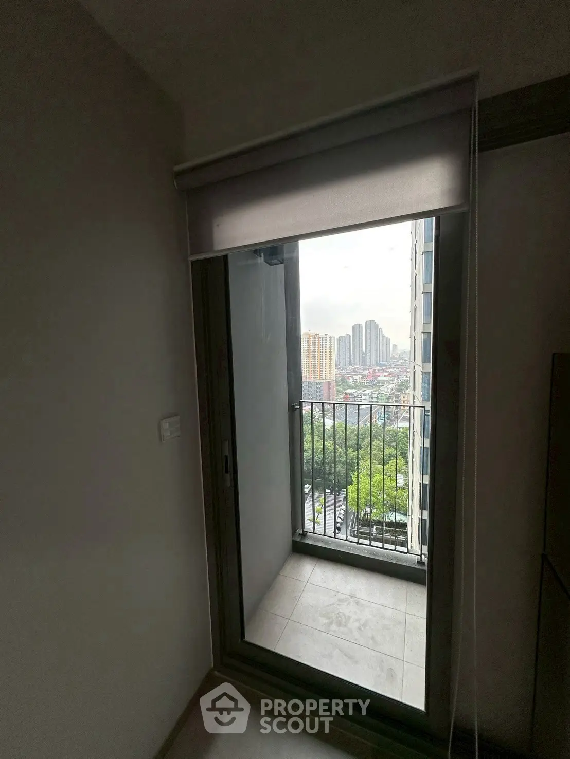 Cozy apartment balcony with city view, perfect for relaxation and enjoying the skyline.
