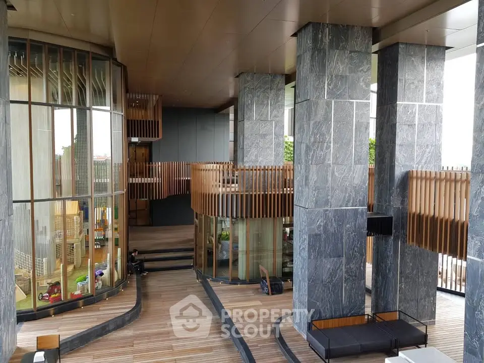 Luxurious modern building entrance with sleek design and wooden accents