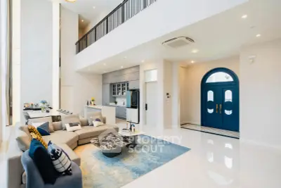 Luxurious modern living room with high ceilings and elegant decor