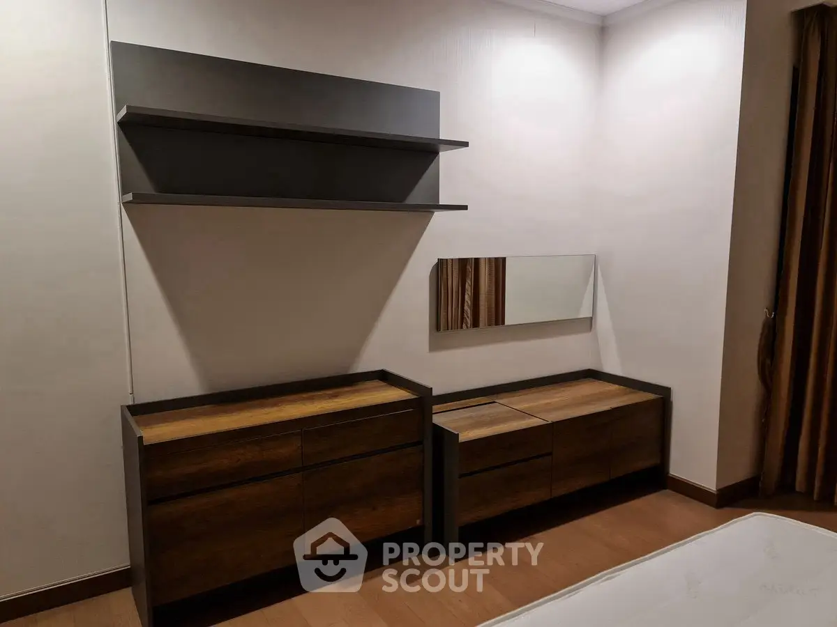 Modern bedroom with sleek wooden furniture and minimalist design