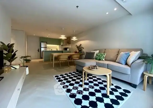 Spacious modern living room with open kitchen and stylish decor