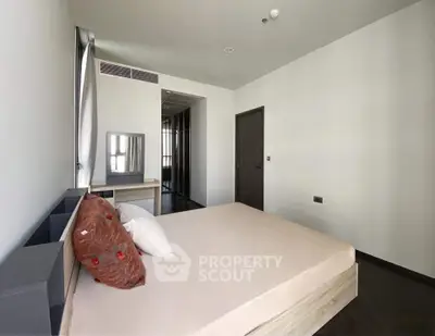 Spacious modern bedroom with minimalist design and natural light